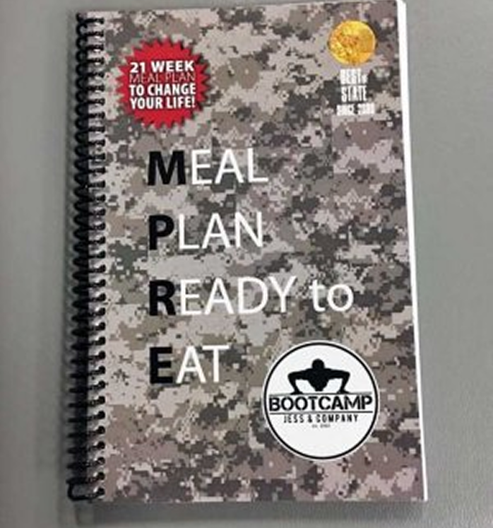 A spiral-bound booklet with a digital camouflage cover titled "MEAL PLAN READY TO EAT." It features a "21 WEEK MEAL PLAN TO CHANGE YOUR LIFE" badge and a "BOOTCAMP JESS & COMPANY" logo at the bottom.